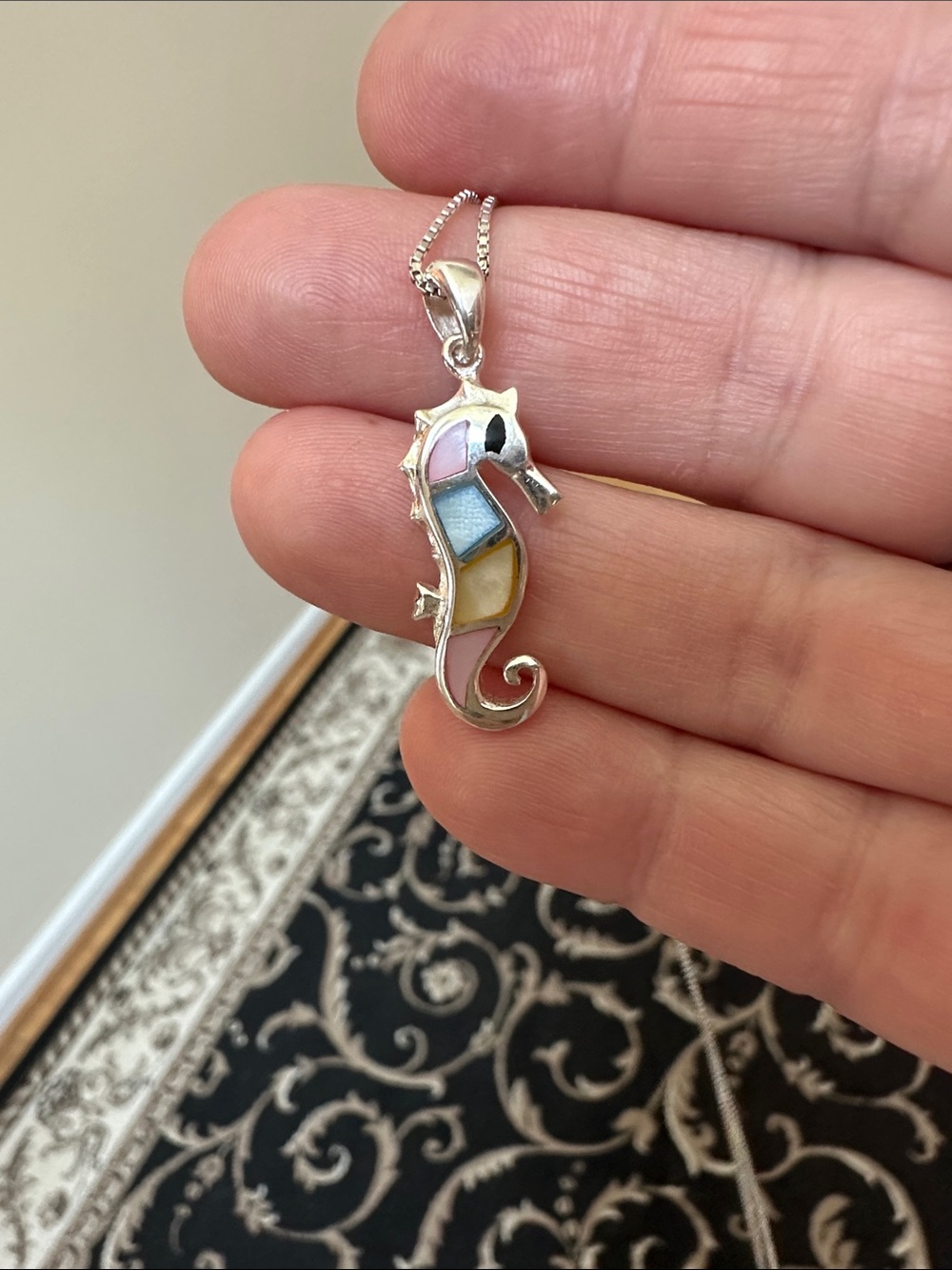 Sterling Silver Seahorse Pendant Necklace in Pink yellow and blue inlay detail.